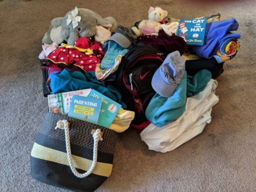 suitcases overflowing with stuff for chore game